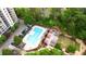Aerial view of a community pool, grilling area, playground, and parking at 795 Hammond Dr # 808, Atlanta, GA 30328