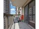Balcony featuring a chair, a view of nearby buildings, and sliding glass doors at 795 Hammond Dr # 808, Atlanta, GA 30328
