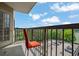 Balcony featuring a chair, metal bars, and views of trees and cars at 795 Hammond Dr # 808, Atlanta, GA 30328