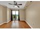 Light-filled bedroom with ceiling fan and balcony access, perfect for relaxing at 795 Hammond Dr # 808, Atlanta, GA 30328