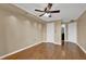 Spacious bedroom featuring hardwood floors, a ceiling fan, and two closets at 795 Hammond Dr # 808, Atlanta, GA 30328