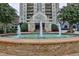 Attractive high-rise building featuring a water fountain and well-maintained landscaping at the entrance at 795 Hammond Dr # 808, Atlanta, GA 30328