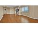 Open concept living area showcasing hardwood floors, neutral paint, and a view into the kitchen at 795 Hammond Dr # 808, Atlanta, GA 30328