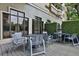 Patio featuring four table and chair sets on a wooden deck outside of a building at 795 Hammond Dr # 808, Atlanta, GA 30328
