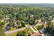 An aerial shot displays this home situated in a neighborhood with tree coverage at 2120 Pair Sw Rd, Marietta, GA 30008