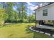The backyard includes a covered patio and an area of lush green lawn at 2120 Pair Sw Rd, Marietta, GA 30008