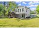 Charming two-story home with a spacious backyard, deck, and walkout basement at 2120 Pair Sw Rd, Marietta, GA 30008