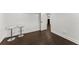 Finished basement with a door, dark wood floors, and white bar stools at 2120 Pair Sw Rd, Marietta, GA 30008