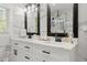 Modern bathroom with double vanity, elegant mirrors, and marble countertops at 2120 Pair Sw Rd, Marietta, GA 30008