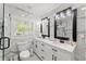 Modern bathroom features double vanity, marble countertops, and glass enclosed shower at 2120 Pair Sw Rd, Marietta, GA 30008