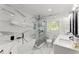Modern bathroom with soaking tub, glass-enclosed shower, and marble countertops at 2120 Pair Sw Rd, Marietta, GA 30008