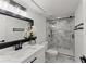 Stylish bathroom with marble tile, glass-enclosed shower, and sleek fixtures at 2120 Pair Sw Rd, Marietta, GA 30008