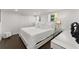 Bright bedroom featuring a large bed, modern decor, and ample natural light at 2120 Pair Sw Rd, Marietta, GA 30008