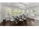 Bright dining room with modern chandelier, large windows, and stylish dining set at 2120 Pair Sw Rd, Marietta, GA 30008