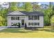 Charming two-story home with a well-manicured lawn and a classic white brick facade at 2120 Pair Sw Rd, Marietta, GA 30008