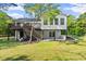Charming home with a rear deck, stairs, white siding, and a well-manicured lawn at 2120 Pair Sw Rd, Marietta, GA 30008