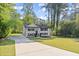 Charming two-story home with a long driveway and a manicured front yard at 2120 Pair Sw Rd, Marietta, GA 30008