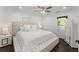 Comfortable bedroom with plush bedding, accent pillows, and ample natural light at 2120 Pair Sw Rd, Marietta, GA 30008
