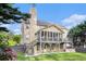 Two story home with covered back patio, fenced backyard, and lush landscaping at 2164 Caneridge Sw Dr, Marietta, GA 30064
