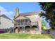 A lovely two story home boasts a covered back patio and fenced backyard, complete with lush landscaping at 2164 Caneridge Sw Dr, Marietta, GA 30064