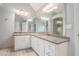 Bathroom featuring double vanity with granite countertop and framed mirror at 2164 Caneridge Sw Dr, Marietta, GA 30064
