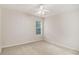 Neutral bedroom featuring a ceiling fan and natural light from the window at 2164 Caneridge Sw Dr, Marietta, GA 30064