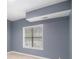 A bedroom featuring neutral colored walls, tile flooring, a window with blinds, and white trim at 2164 Caneridge Sw Dr, Marietta, GA 30064