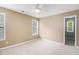 Bedroom with neutral carpet, natural light, and a ceiling fan at 2164 Caneridge Sw Dr, Marietta, GA 30064