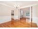 Bright dining area featuring hardwood floors, decorative columns and wainscoting detail at 2164 Caneridge Sw Dr, Marietta, GA 30064
