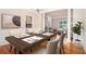 Elegant dining room with a dark wood table, seating for six, and hardwood flooring at 2164 Caneridge Sw Dr, Marietta, GA 30064