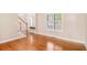 Inviting entryway boasting gleaming hardwood floors, staircase and a window with natural light at 2164 Caneridge Sw Dr, Marietta, GA 30064