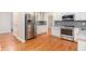 Bright kitchen featuring stainless appliances, white cabinetry, and granite countertops at 2164 Caneridge Sw Dr, Marietta, GA 30064