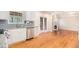 Modern kitchen with stainless steel appliances and granite countertops open to the living area at 2164 Caneridge Sw Dr, Marietta, GA 30064