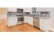 Well-lit kitchen featuring modern stainless steel appliances and granite countertops at 2164 Caneridge Sw Dr, Marietta, GA 30064