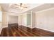 Bright living room featuring hardwood floors, fan and view to the next room at 2164 Caneridge Sw Dr, Marietta, GA 30064