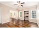 A bright living room with gleaming hardwood floors, neutral colored walls, and built in bookshelves at 2164 Caneridge Sw Dr, Marietta, GA 30064