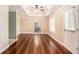 Bright living room featuring hardwood floors, fan and white doors at 2164 Caneridge Sw Dr, Marietta, GA 30064