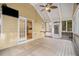 Inviting screened porch with ceiling fan, exterior access, and views to the kitchen at 2164 Caneridge Sw Dr, Marietta, GA 30064