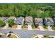 An aerial shot of a neighborhood showcasing well-maintained homes with lush greenery and landscaping at 235 Cornerstone Dr, Woodstock, GA 30188