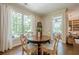 This home features a formal dining area with lots of natural light and seating for four at 235 Cornerstone Dr, Woodstock, GA 30188