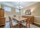 Formal dining room with a wooden table, chandelier, and classic decor for Gathering gatherings at 235 Cornerstone Dr, Woodstock, GA 30188