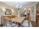 Elegant dining room with hardwood floors, chandelier, and classic furniture at 235 Cornerstone Dr, Woodstock, GA 30188