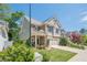 Attractive home featuring stone accents, a covered front porch, and well-manicured landscaping at 235 Cornerstone Dr, Woodstock, GA 30188
