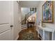 Elegant foyer with hardwood floors, staircase, baby grand piano, and sophisticated decor at 235 Cornerstone Dr, Woodstock, GA 30188