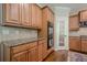 This home features a gourmet kitchen with granite countertops, custom cabinets, and modern appliances at 235 Cornerstone Dr, Woodstock, GA 30188
