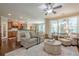 Inviting living room with fireplace, hardwood floors, and seamless flow to the kitchen at 235 Cornerstone Dr, Woodstock, GA 30188