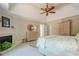 Spacious main bedroom with tray ceiling, fireplace, and neutral tones at 235 Cornerstone Dr, Woodstock, GA 30188
