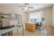 Home office with desk, shelving, and natural light from window at 235 Cornerstone Dr, Woodstock, GA 30188