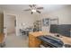 Bright office with a ceiling fan, shelving, and a spacious desk for working from home at 235 Cornerstone Dr, Woodstock, GA 30188