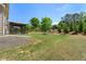 Expansive backyard with lush green grass, mature trees, and a charming gazebo for outdoor relaxation at 3051 Mountain Shadow Way, Marietta, GA 30064